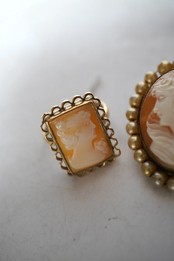 A yellow metal shell cameo ring, a brooch and a pendant. Condition - fair